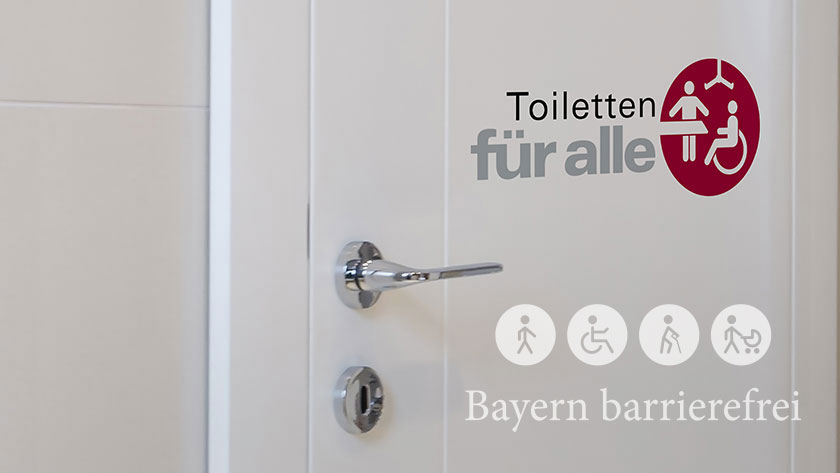 Tür mit Logo „Toiletten für alle“.
